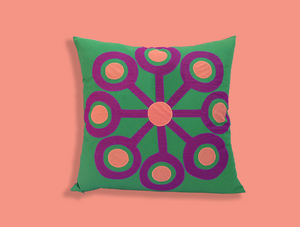 Purple Pinwheel on Green Pillow
